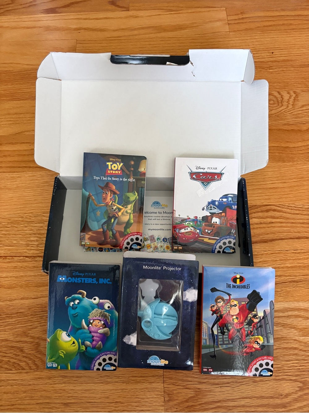 Moonlite Projector with Disney Pixar Story Reels - Blue